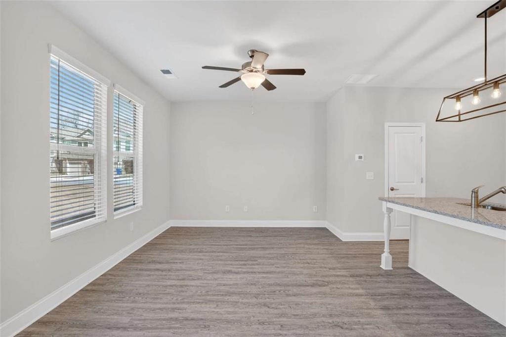 3405 Ripple Loop, Unit 127 South Fulton, GA 30349 - Photo 8 of 26 a view of empty room with wooden floor and fan