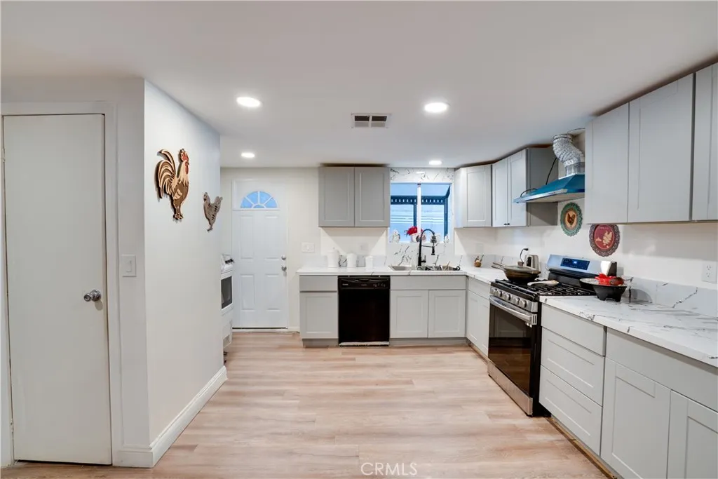 3700 Buchanan Street, Unit 189 Riverside, CA 92501 - Photo 13 of 44 a kitchen with a refrigerator and a stove top oven
