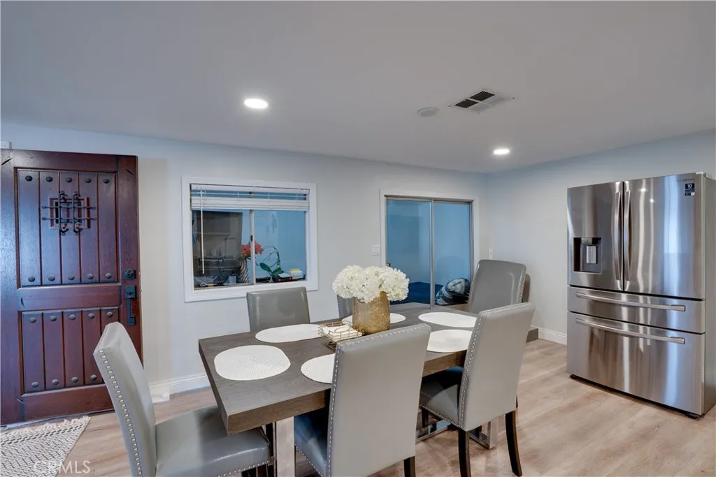 3700 Buchanan Street, Unit 189 Riverside, CA 92501 - Photo 14 of 44 a view of a dining room with furniture window and wooden floor