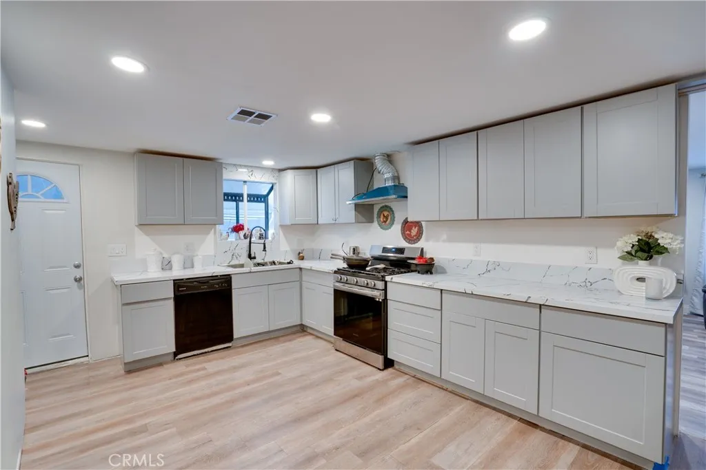 3700 Buchanan Street, Unit 189 Riverside, CA 92501 - Photo 16 of 44 a kitchen with stainless steel appliances granite countertop a sink and cabinets