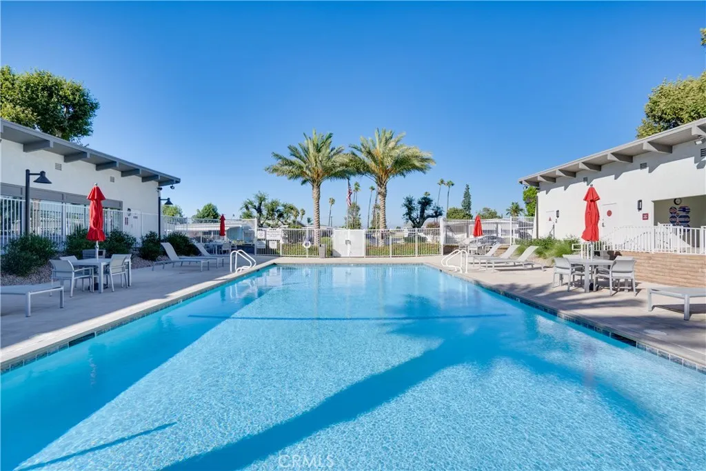 3700 Buchanan Street, Unit 189 Riverside, CA 92501 - Photo 30 of 44 a swimming pool with outdoor seating and yard