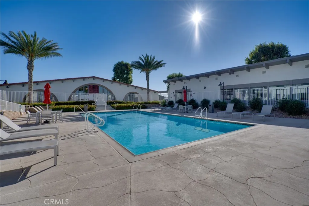 3700 Buchanan Street, Unit 189 Riverside, CA 92501 - Photo 31 of 44 a swimming pool with outdoor seating and yard