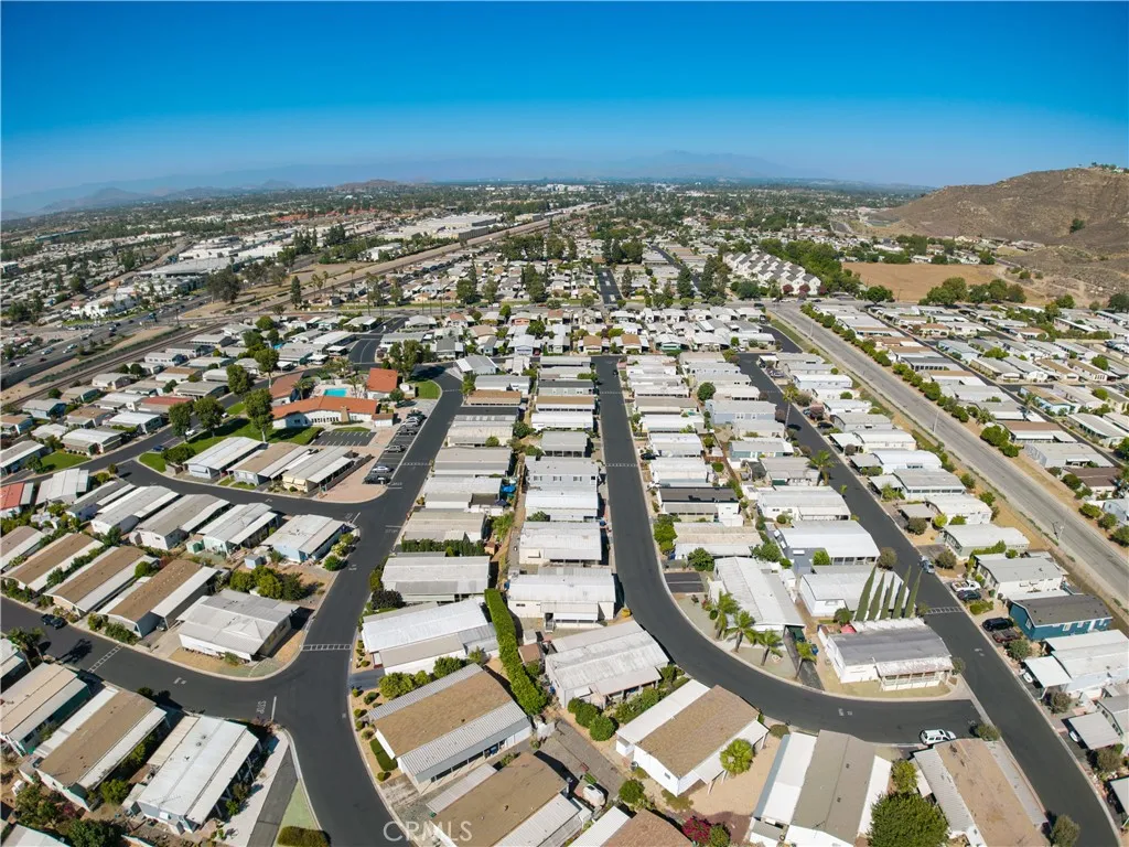 3700 Buchanan Street, Unit 189 Riverside, CA 92501 - Photo 41 of 44 an aerial view of a residential apartment building with a swimming pool