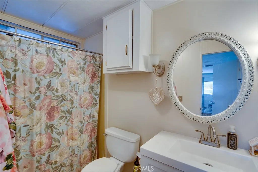 3700 Buchanan Street, Unit 189 Riverside, CA 92501 - Photo 7 of 44 a bathroom with a sink and a mirror