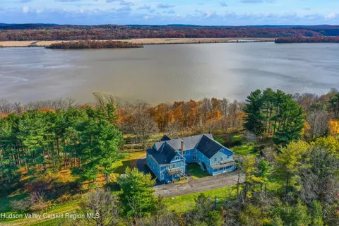 a view of interior space with wooden floor and fireplace