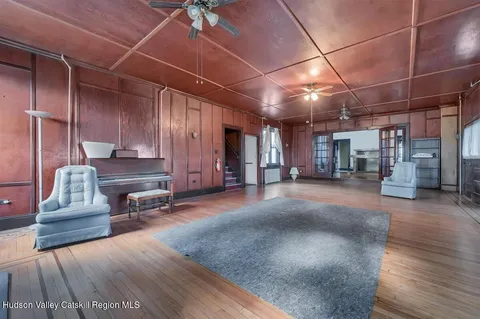 a kitchen with a stove a refrigerator and a stove top oven