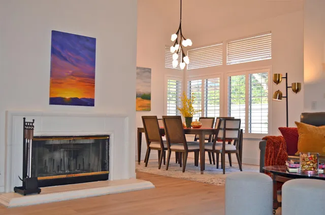 a view of a livingroom with furniture window and wooden floor