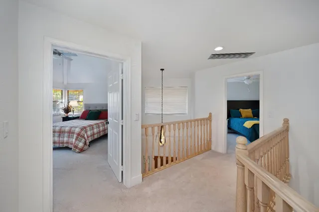 a view of a bedroom with furniture and windows