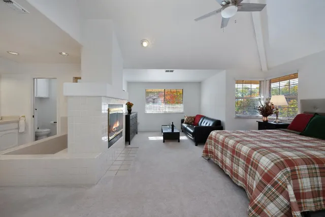 a bed room with two bed and a chandelier