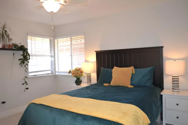 a bedroom with a bed and window