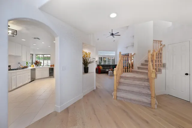a view of an entryway with livingroom and wooden floor
