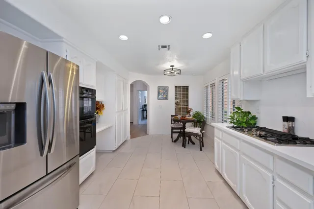 a kitchen with counter top space and refrigerator