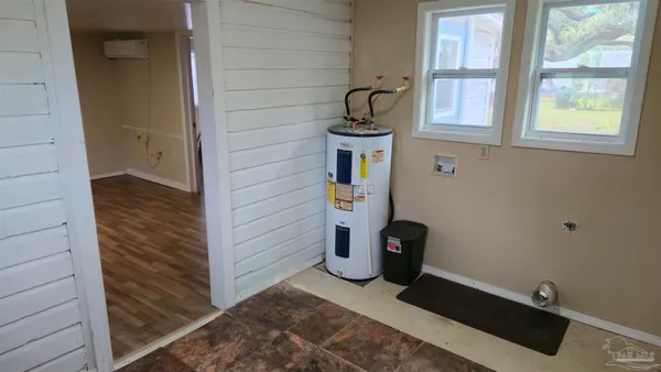 a kitchen with wooden floors and sink