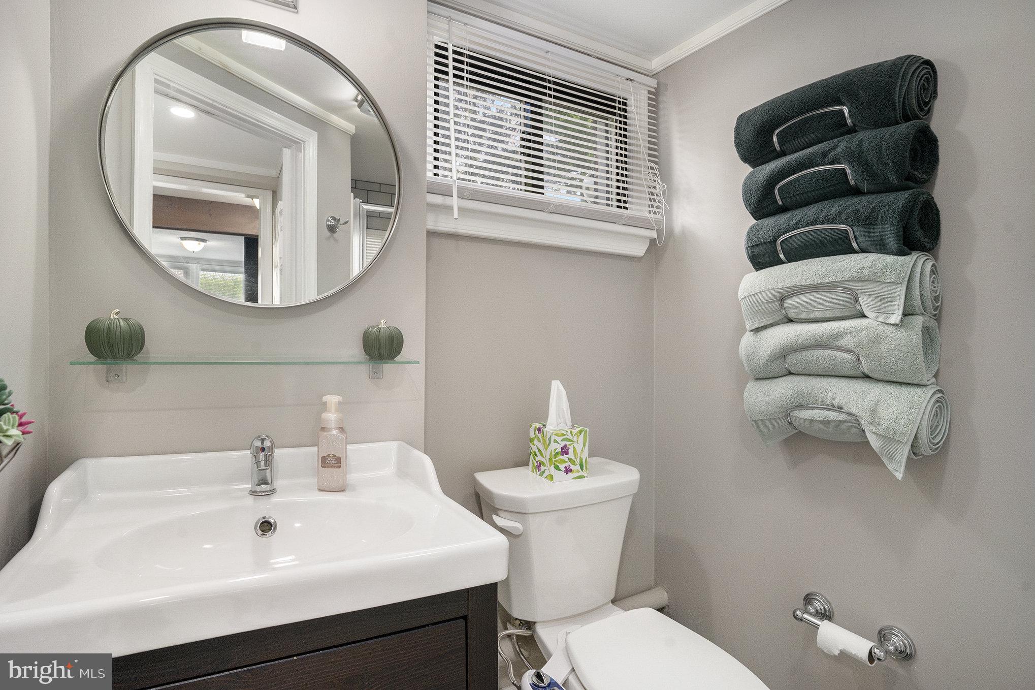 1271 Phoenixville Pike West Chester, PA 19380 - Photo 15 of 33 a bathroom with a toilet a sink and mirror