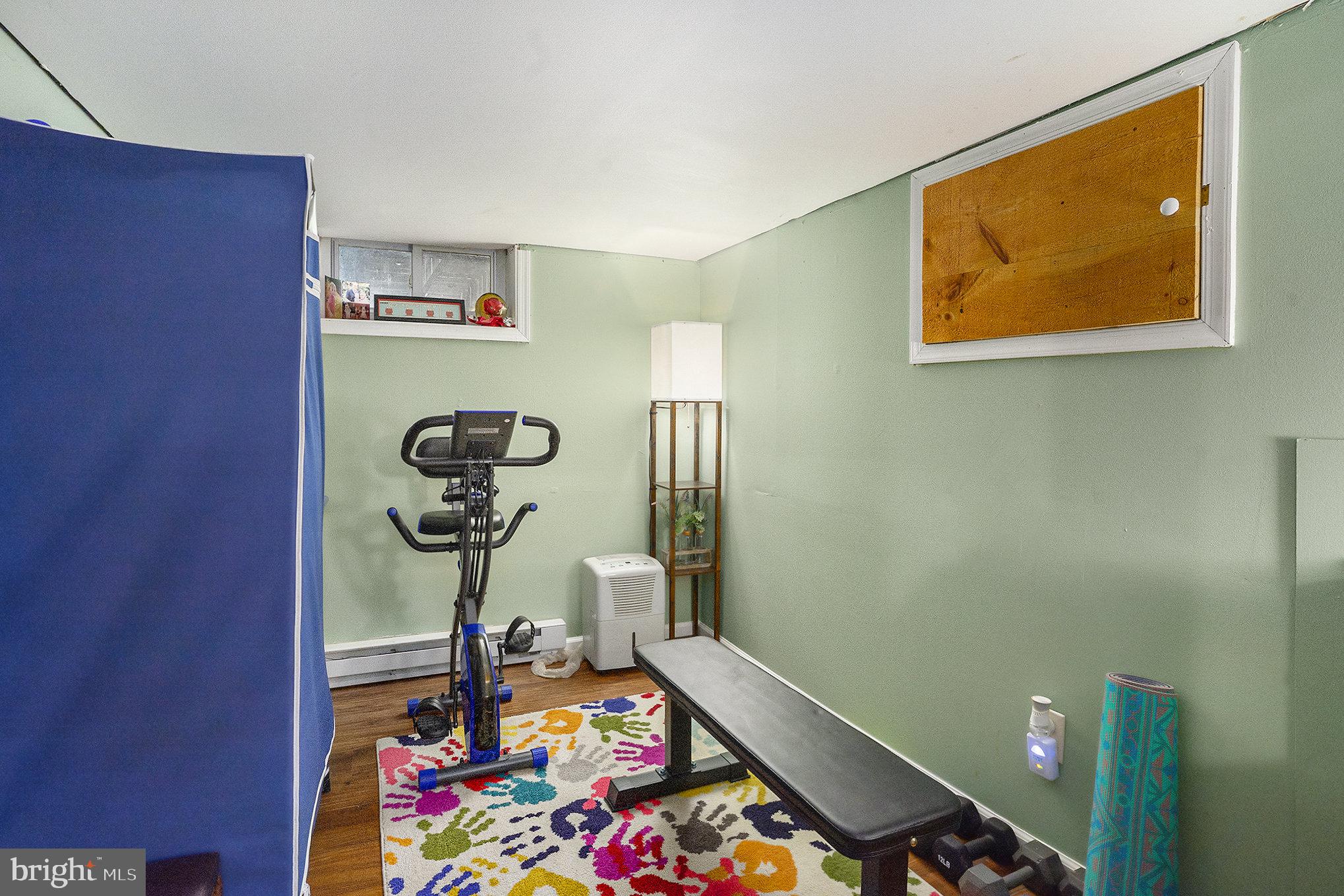 1271 Phoenixville Pike West Chester, PA 19380 - Photo 22 of 33 a room with painting on the wall and a lamp