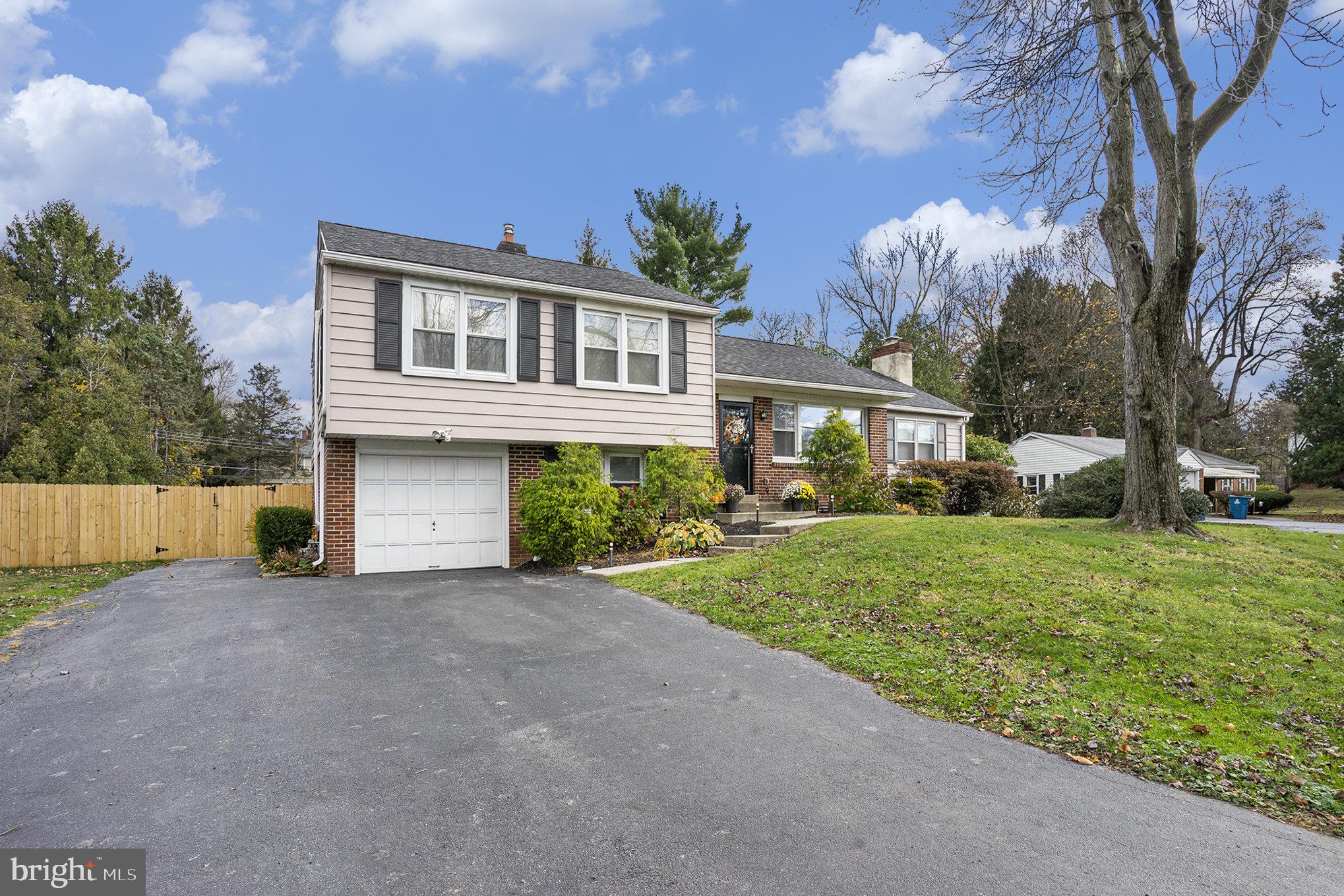 1271 Phoenixville Pike West Chester, PA 19380 - Photo 3 of 33 a front view of a house with a yard and garage