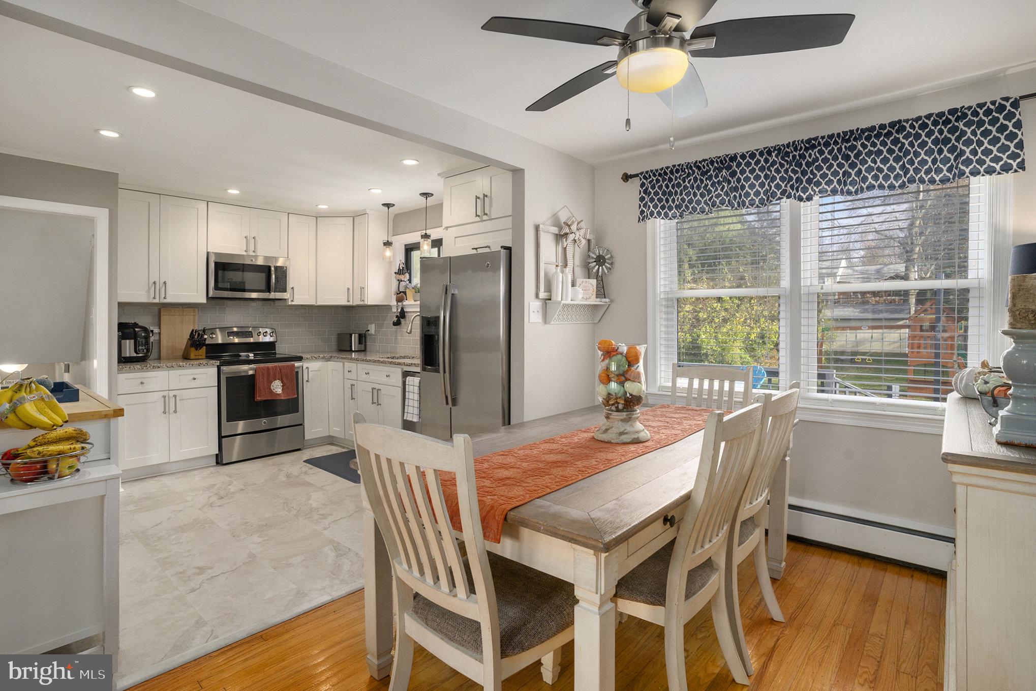 1271 Phoenixville Pike West Chester, PA 19380 - Photo 6 of 33 a kitchen with kitchen island a refrigerator and a stove top oven