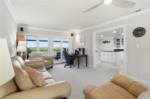 a view of a dining room with furniture and window