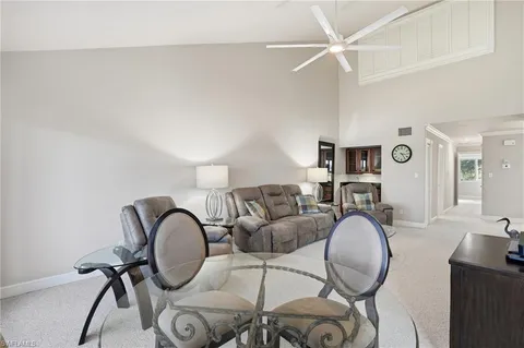 a bathroom with a granite countertop sink and a bathtub