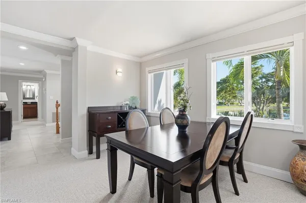 a view of a dining room with furniture and window