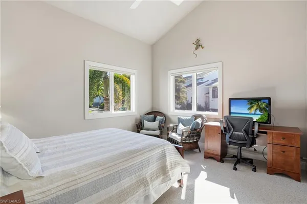 a bedroom with a bed and a table in it