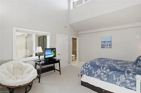 a view of a hallway with a dining table chairs and entryway