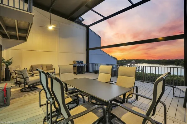 a view of a balcony with chairs