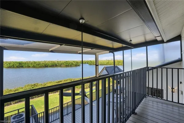 a balcony with hardwood area and city view