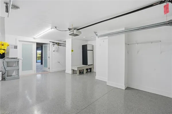 a view of a hallway with a dining table chairs and entryway