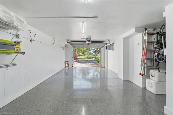 a view of a big room with wooden floor and natural light