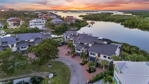 an aerial view of a house with a lake view