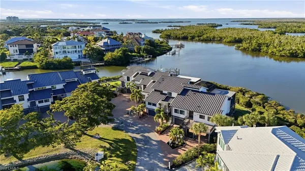 an aerial view of a house with a lake view