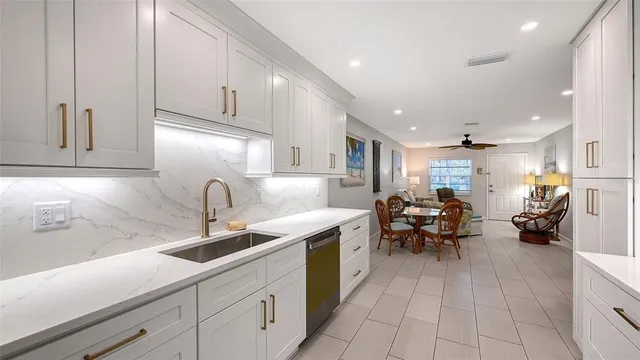 a kitchen with stainless steel appliances granite countertop a sink and cabinets