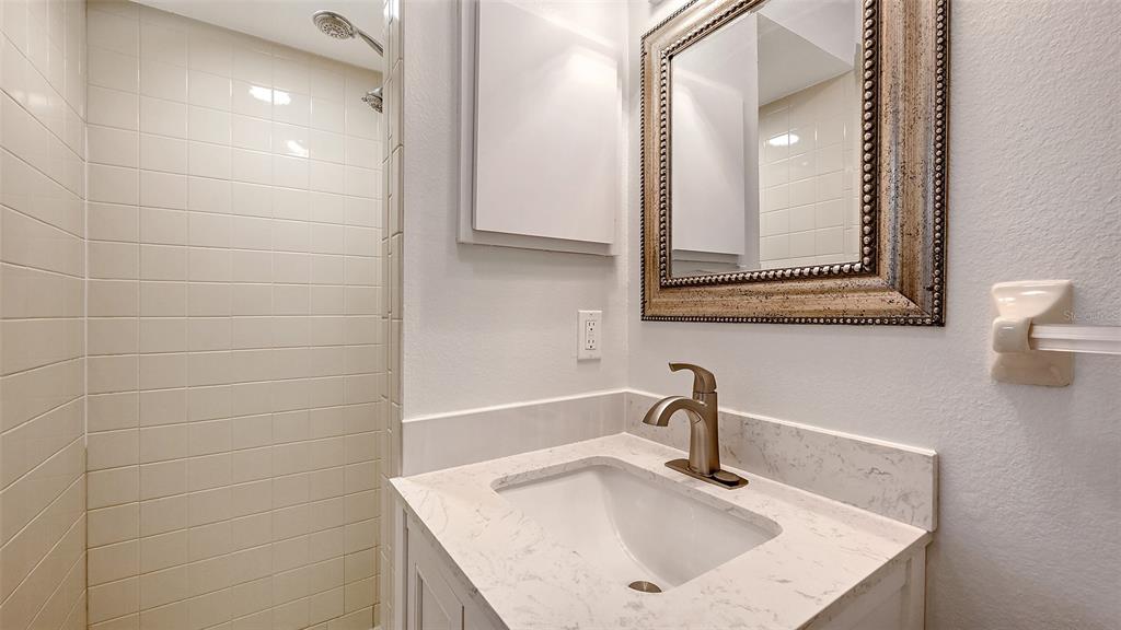 100 Bayshore Road, Unit C Nokomis, FL 34275 - Photo 18 of 39 a bathroom with a sink and a mirror
