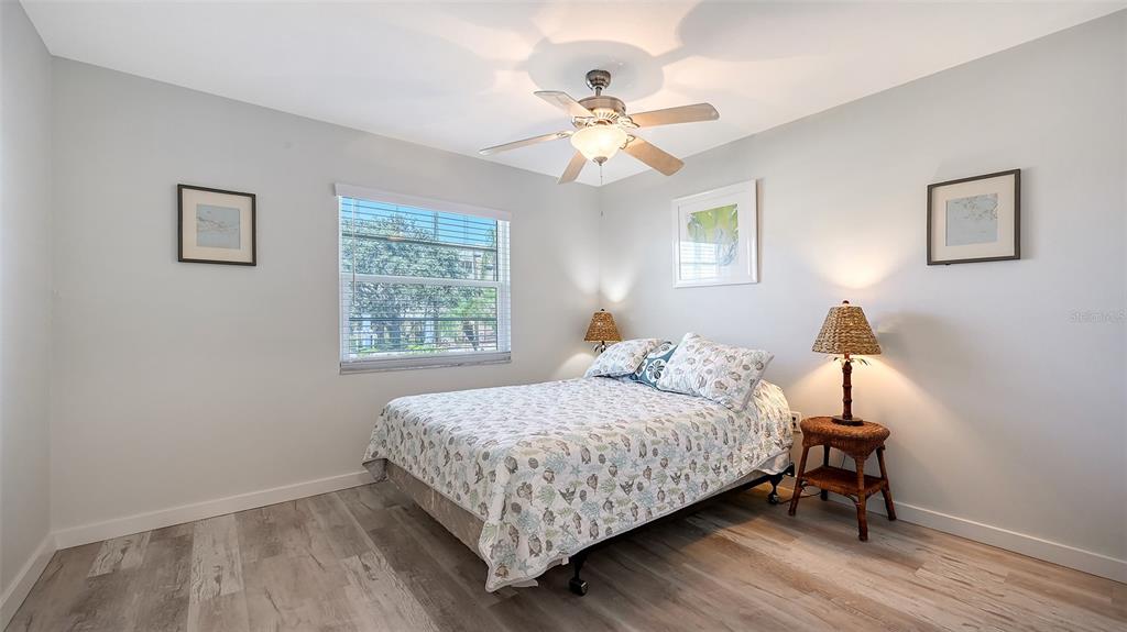 100 Bayshore Road, Unit C Nokomis, FL 34275 - Photo 19 of 39 a bedroom with a bed and a window