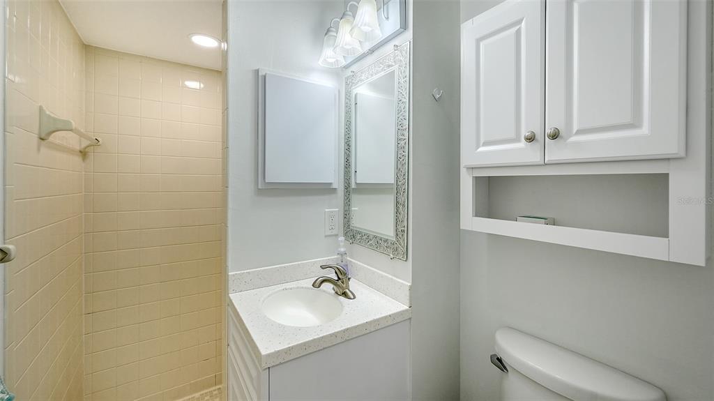 100 Bayshore Road, Unit C Nokomis, FL 34275 - Photo 21 of 39 a bathroom with a sink a toilet and shower