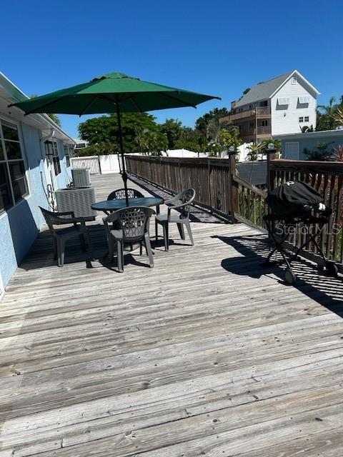 100 Bayshore Road, Unit C Nokomis, FL 34275 - Photo 26 of 39 a view of a terrace with sitting area