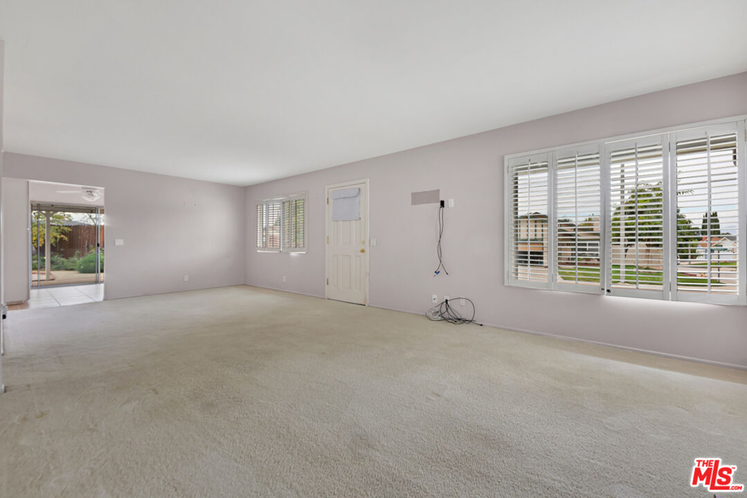 13480 Laurelhurst Road Moorpark, CA 93021 - Photo 7 of 34 a view of an empty room with a window