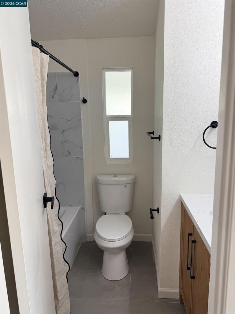 60 Wilson Way Milpitas, CA 95035 - Photo 19 of 22 a bathroom with a toilet and a shower