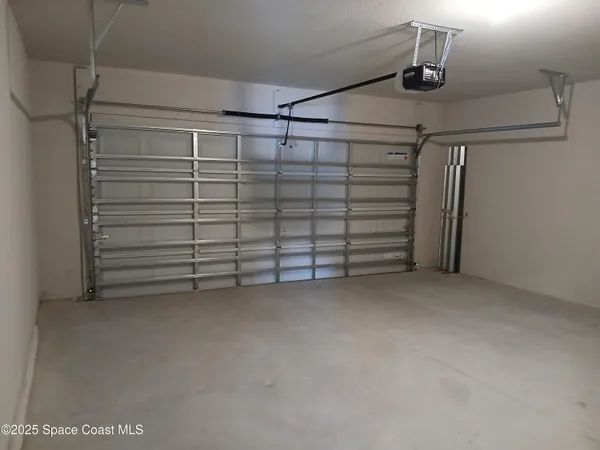 a view of walk in closet with clothes