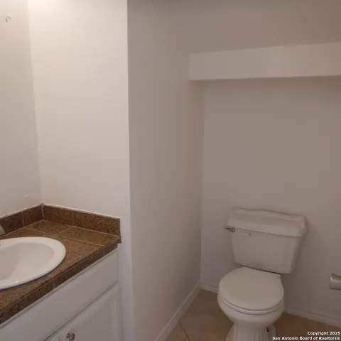 a kitchen with stainless steel appliances granite countertop a stove a refrigerator and a cabinets