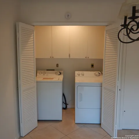 a kitchen with granite countertop a refrigerator and a sink
