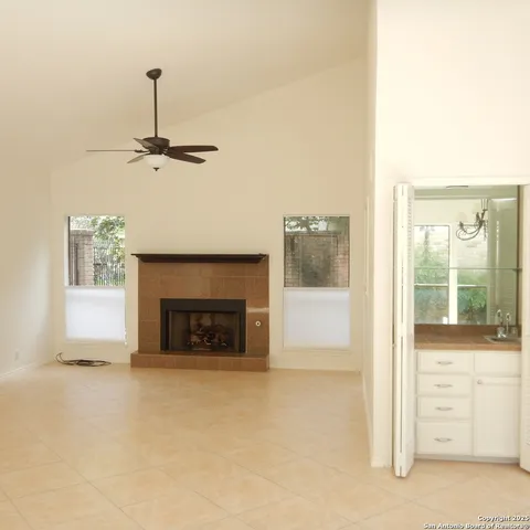 a view of an empty room with a fireplace