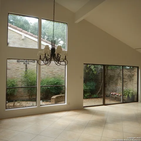 a view of a glass door and the front door