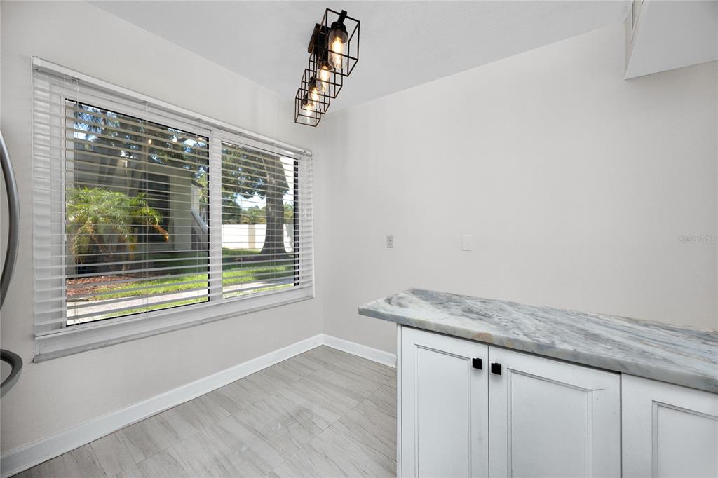 2207 Belleair Road, Unit B4 Clearwater, FL 33764 - Photo 7 of 37 a view of a kitchen with a window