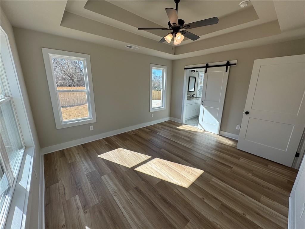 1612 Pickens Street Ball Ground, GA 30107 - Photo 19 of 53 a view of empty room with wooden floor and fan