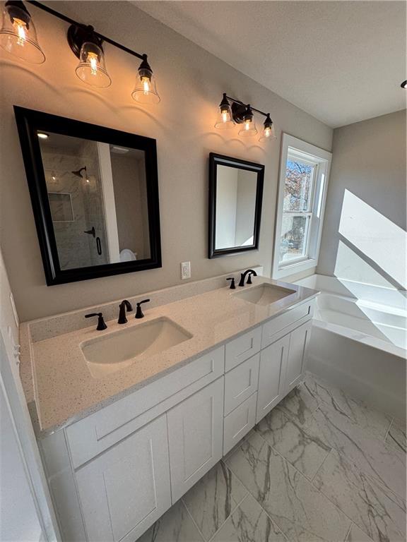 1612 Pickens Street Ball Ground, GA 30107 - Photo 20 of 53 a bathroom with double vanity and two mirror