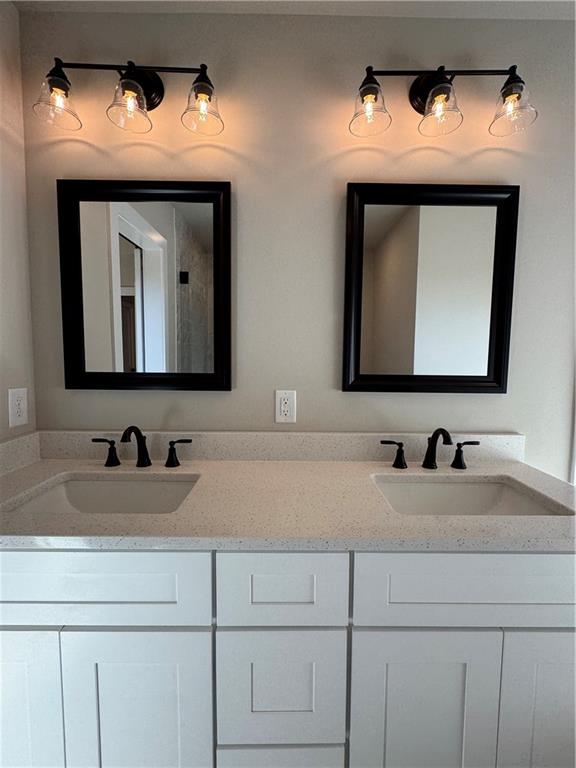 1612 Pickens Street Ball Ground, GA 30107 - Photo 22 of 53 a bathroom with mirror two sink and a mirror