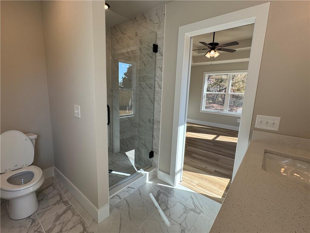 1612 Pickens Street Ball Ground, GA 30107 - Photo 26 of 53 a bathroom with a toilet and a shower