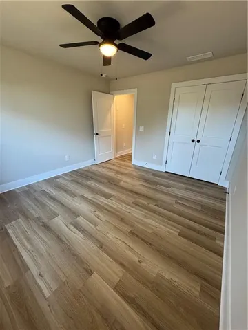 a bathroom with a toilet a sink a mirror and bathtub